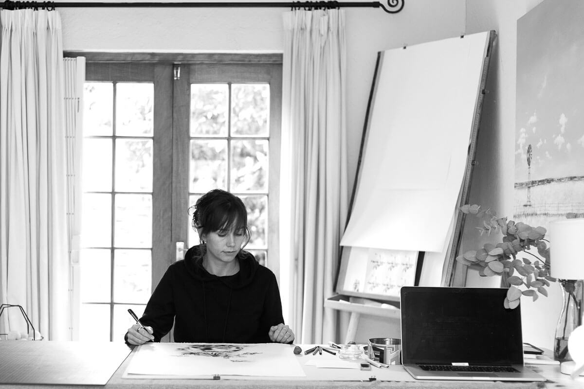 Black and white photo of Kendall-Leigh Nash in her studio